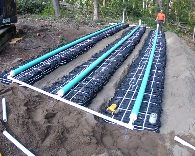 Excavator installing a new residential septic system on a Northeast PA property