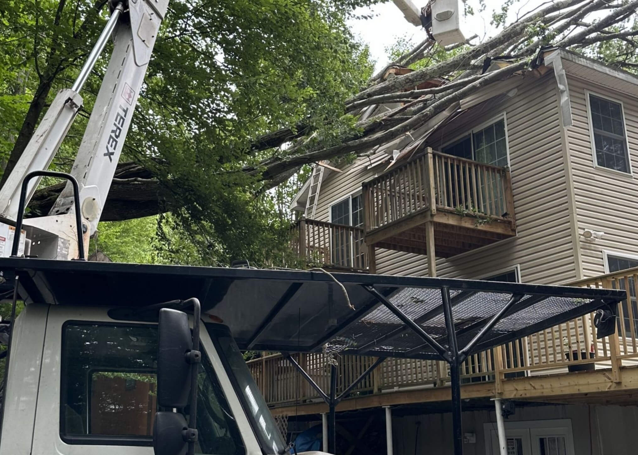 Freeman The Treeman crew removing a storm-damaged tree from a Northeast Pennsylvania home